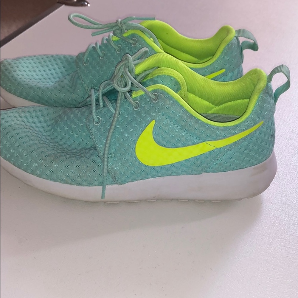 Blue and neon yellow Nike Roshe